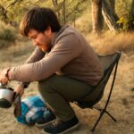Beginner backpack camping kit with a tent, sleeping bag, sit pad, stove, and food bag