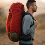 Backpack arranged with lightweight hiking gear before loading