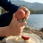 Compact ultralight backpacking kit with a small knife and trail map