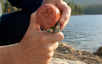 Compact ultralight backpacking kit with a small knife and trail map